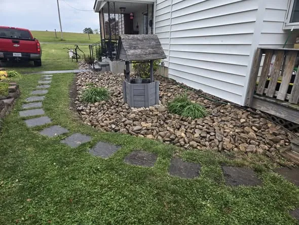 Flagstone stepping stone path through a landscaped rock bed