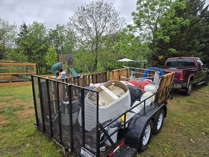 Pickup truck and loaded utility trailer on a hauling job